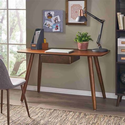This modern desk is made from engineered wood, with a walnut color and an espresso finish. Modern and Contemporary Study Table Design Ideas