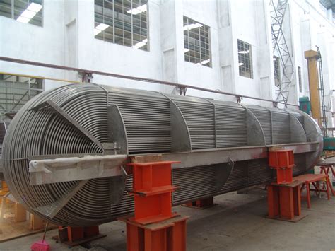 Copper tubes are arranged in bundle & can be directly inserted in the hydraulic tank and water is allowed to circulate through the cooper tube there by cooling the oil. HEAT EXCHANGER