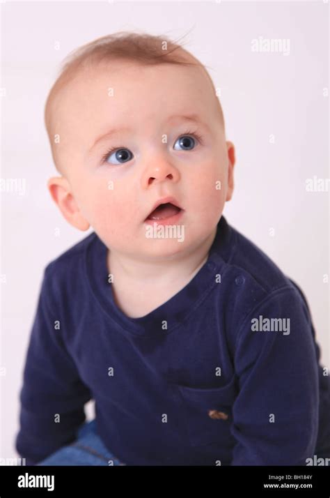 6 Month Old Red Haired Baby Boy Sitting Stock Photo Alamy