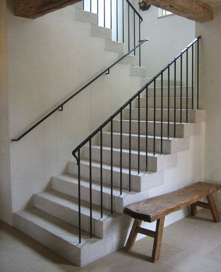You can see the design of a spiral staircase made of wood with a stair railing that has. french railing design simple and attached to outside ...