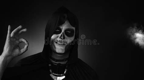 Scary Creepy Man In Skeleton Halloween Costume Looking At Camera With
