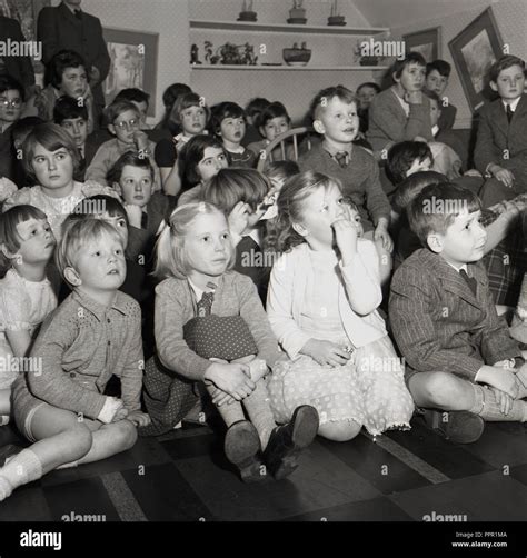 1950s Historical Group Of Primary Schoolchildren Sitting Together On