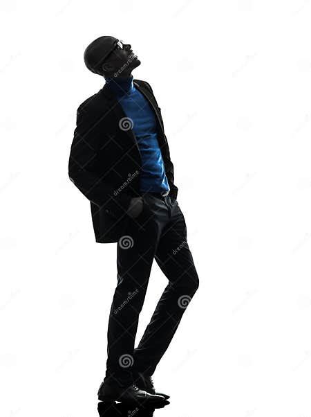 African Black Man Standing Looking Up Smiling Silhouette Stock Photo