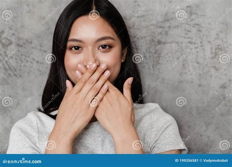 image of joyful beautiful asian girl covering her mouth stock image image of mouth asian