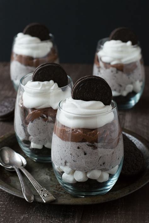 There are oreos crumbs, marshmallows, homemade oreo fluff, rich chocolate cheesecake, a dollop of cool whip and it's all topped off with an oreo. Over the Top Chocolate Cheesecake Oreo Parfaits