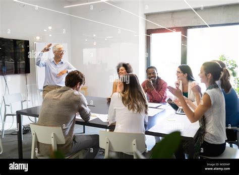 Cheerful Coworkers In Office During Company Meeting Stock Photo Alamy