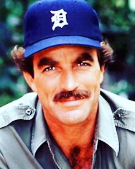 A Man With A Mustache Wearing A Detroit Tigers Hat