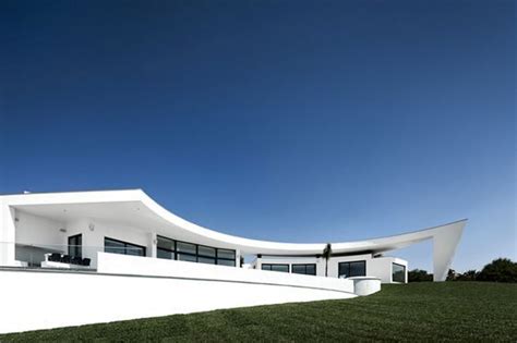 Arc House With Luxury Interiors And Edgy Curved Roof Met