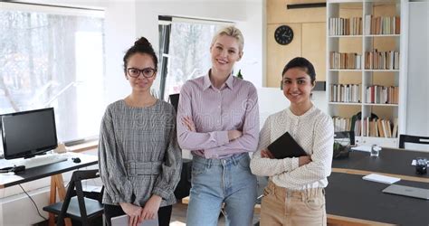 Diverse Female Colleagues Posing Threesome For Corporate Album In