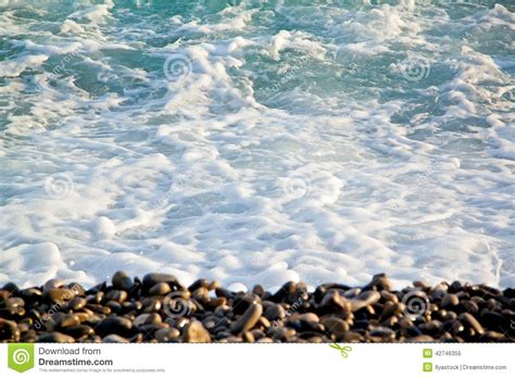 Azure Sea Waves Clear Blue Water With White Foam Pebbles