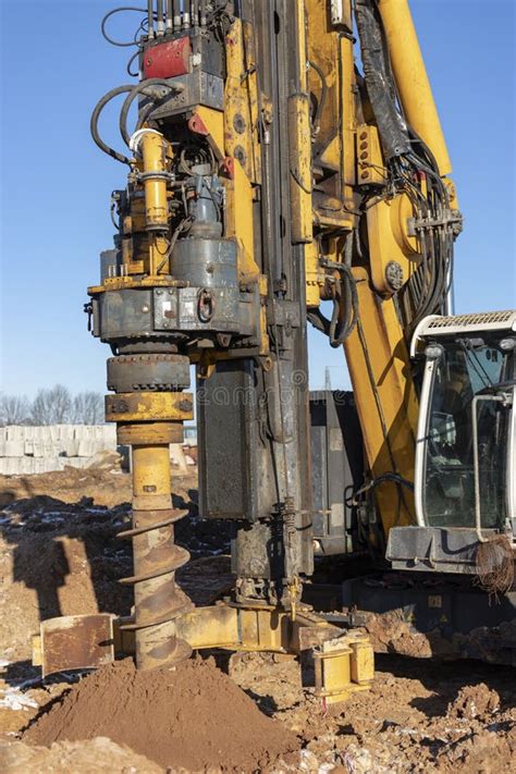 A Powerful Drilling Rig With An Auger Drills A Well At A Construction