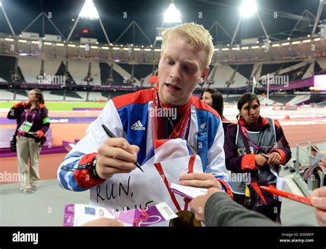 Great Britains Jonnie Peacock Signs Autographs For Fans After Winning