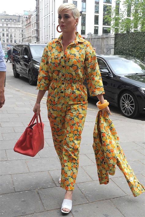 Katy Perry Wears A Bright Yellow Floral Print Jumpsuit As She Steps Out In London Uk 0105194
