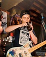 Young Billie Joe Armstrong smoking a makeshift bong on stage at what is ...