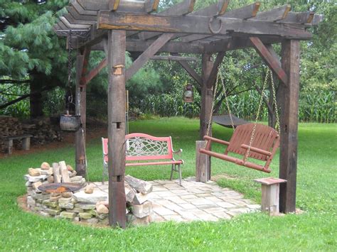 You'll be sitting around a fire on a cool evening before you know it. Old World style pergola with firepit, seating and cooking ...