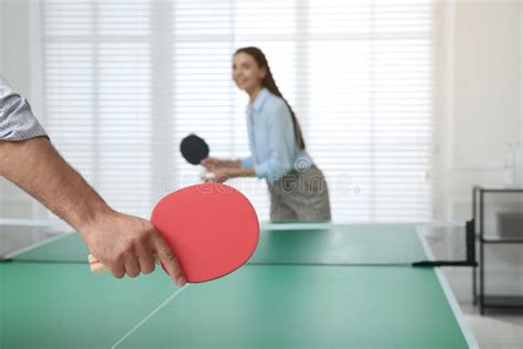 Business People Playing Ping Pong In Office Focus On Racket Stock