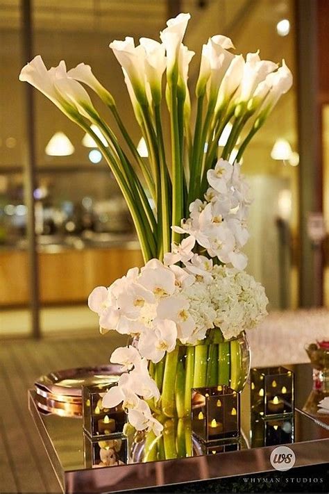 Tall Centerpiece Calla Lily Wrapped In White Orchids And Hydrangea