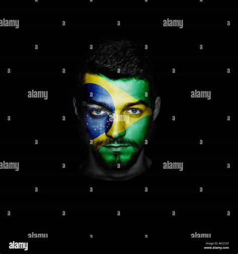 Flag Of Brazil Painted On A Face Of A Man Stock Photo Alamy
