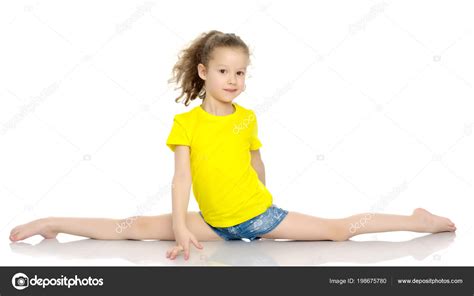 Girl Gymnast Perform The Twine Exercise Stock Photo By Lotosfoto