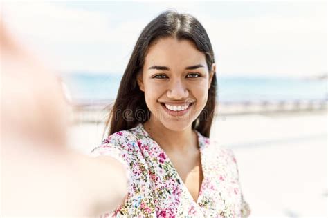 Young Latin Girl Smiling Happy Making Selfie By The Camera At The Beach Stock Image Image Of