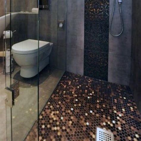 Placed on white penny floor tiles accented with gray grout, a white washstand is accented with a slatted shelf, brass hardware, and a honed black marble countertop holding an oval sink beneath an brass gooseneck faucet. Top 60 Best Penny Floor Design Ideas - Copper Coin Flooring
