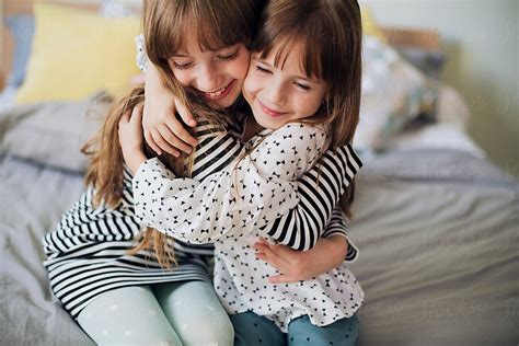 Sisters Hugging Each Other By Stocksy Contributor Lumina Stocksy