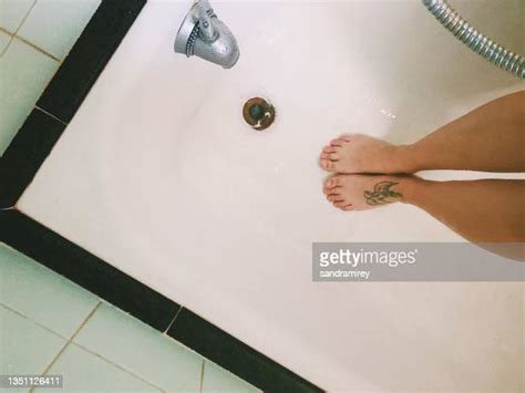 washing legs shower photos and premium high res pictures getty images