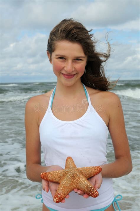 Teenager With Starfish On The Beach Stock Photo Image Of Outdoor