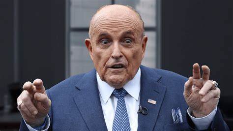 The Person Slapping Rudy Giuliani On His Back Is In Custody Police Say
