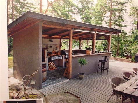 The kitchen counter area is covered beautifully with. Kesäkeittiö | Outdoor kitchen design, Rustic outdoor ...