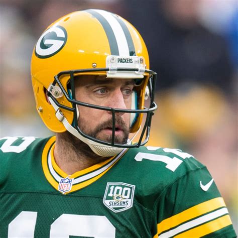 why does aaron rodgers wear a different helmet helmeting