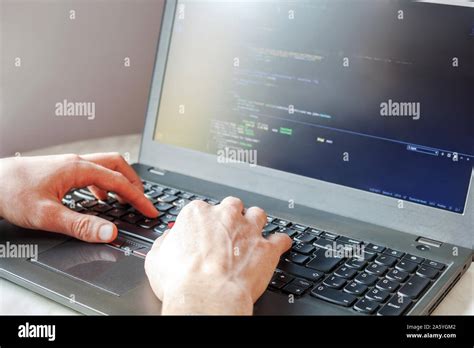 Programmer Coding On Laptop Computer Coder Hand Closeup Writing