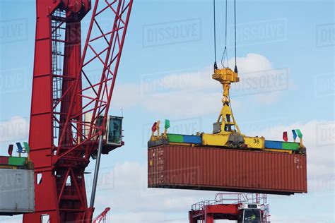 Crane Lifting Shipping Container Stock Photo Dissolve