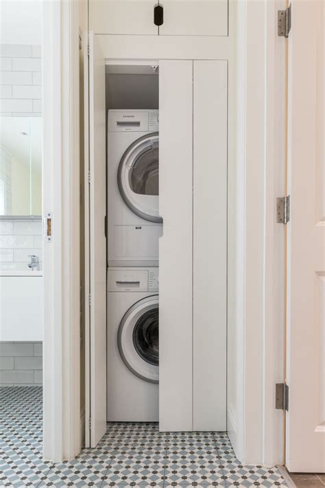 Washing Machine And Dryer In Cupboard Stacked Laundry Room Tiny Laundry Rooms Laundry In