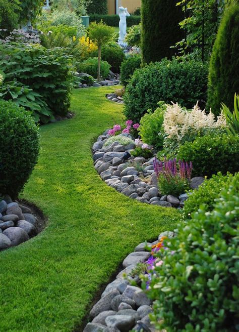 Natural Looking Garden Edging River Rocks Used Along Grass Garden