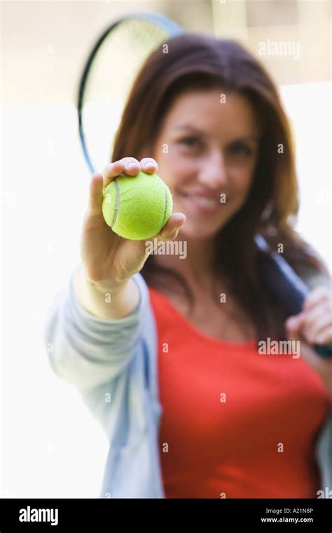 Woman Holding Tennis Ball Stock Photo Alamy