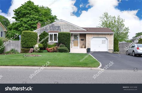 Suburban Middle Class Home Landscaped Front Yard Lawn Driveway