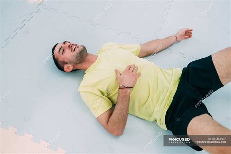 Exhausted Man Lying On Floor On Back — Sport Male Stock Photo