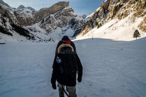 Hiking Over Frozen Lake With Small Village Swiss Mountains Editorial
