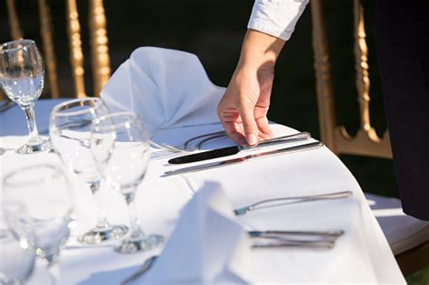Waiter Setting The Table In Restaurant Stock Photo Download Image Now