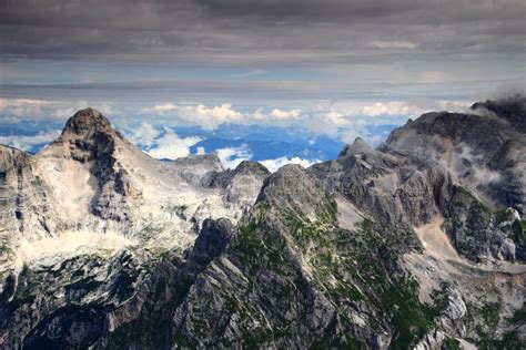 Razor And Pihavec Peaks Under Layer Of Clouds Julian Alps Stock Image