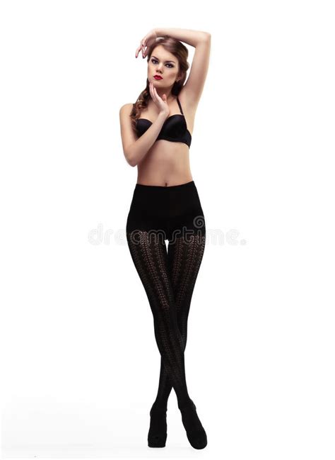 Sexy Meisje In Zwarte Nylonkousen En Bustehouder Stock Afbeelding