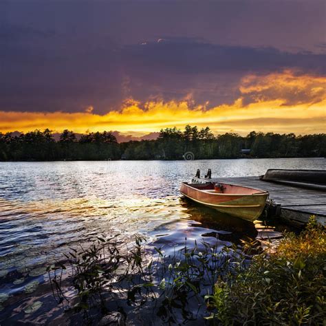 Boat Docked On Lake At Sunset Stock Photo Image Of River Evening