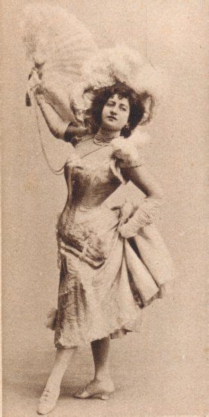 An Old Fashion Photo Of A Woman In A Dress And Hat With Her Arms