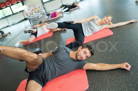group of gym people at a stretching stock image colourbox