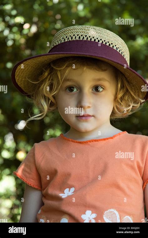 Little Girl Wearing A Straw Hat Stock Photo Alamy