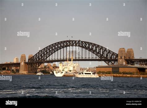 Merchant Ship Vessel And Harbour Bridge From Darling Harbour In Sydney
