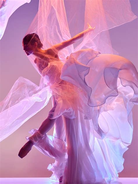 Ballerina Young Graceful Female Ballet Dancer Dancing Over Pink Studio