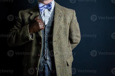 Portrait Of Elegant English Gentleman In Tweed Suit Standing Proudly