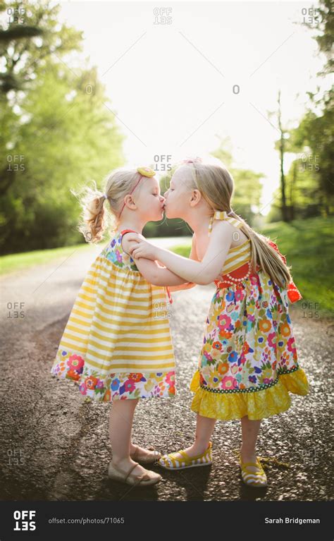 Two Cute Sister Kissing And Hugging In Forest Stock Photo Offset
